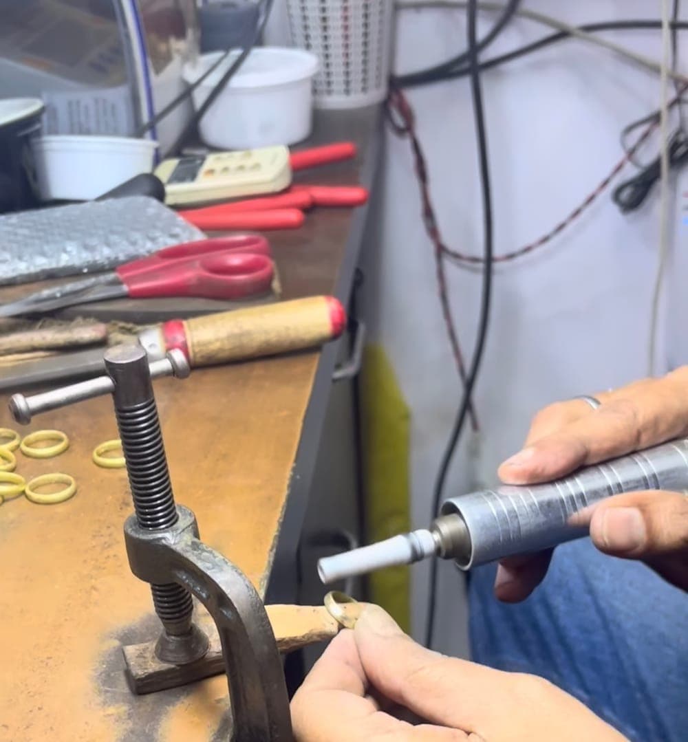 Artisan handcrafting and finishing ring in Mumbai